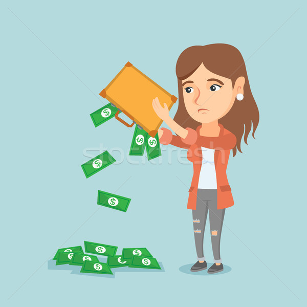 Penniless woman shaking out money from briefcase. Stock photo © RAStudio