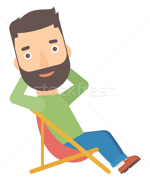 Man sitting in a folding chair. Stock photo © RAStudio