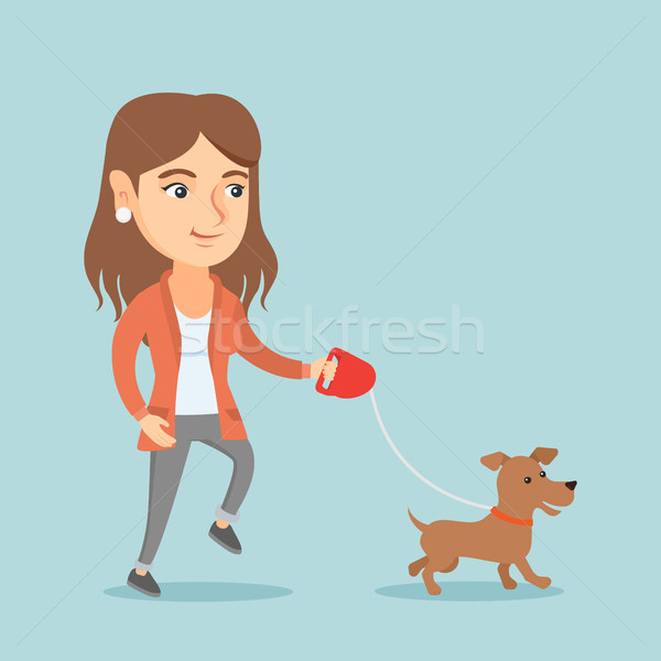 Young caucasian woman walking with her dog. Stock photo © RAStudio
