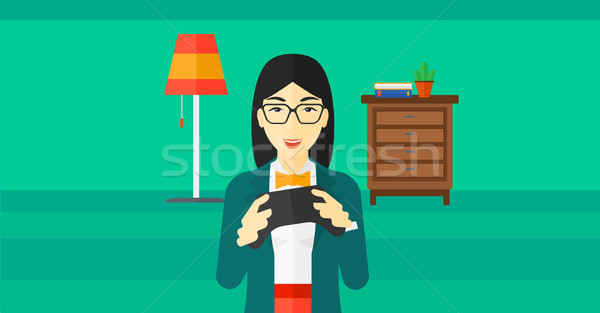 Woman playing video game. Stock photo © RAStudio