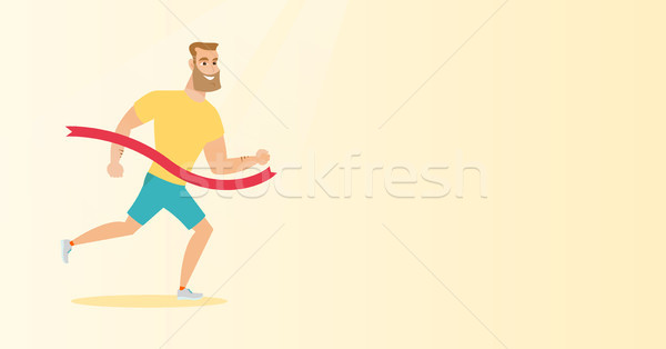 Young caucasian sportsman crossing finish line. Stock photo © RAStudio