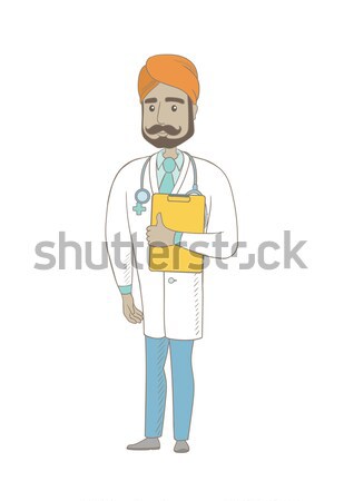 Young indian doctor examining a radiograph. Stock photo © RAStudio