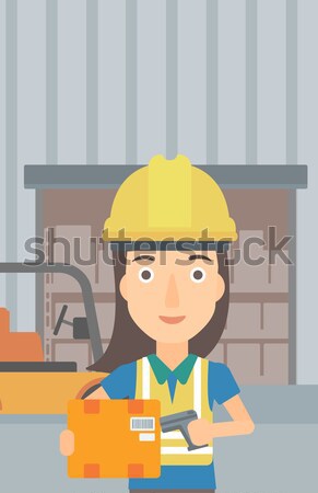 Warehouse worker scanning barcode on box. Stock photo © RAStudio
