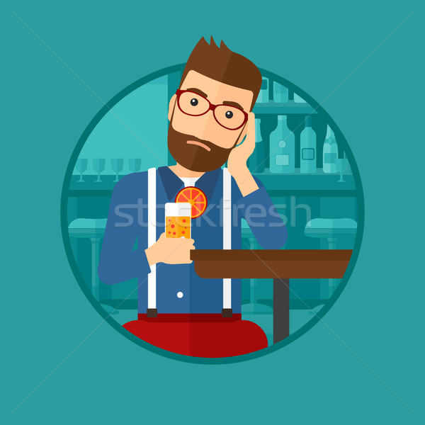Man drinking orange cocktail at the bar. Stock photo © RAStudio