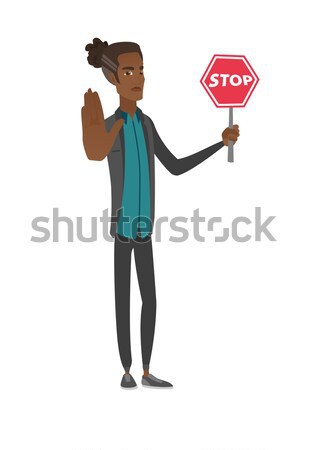 Caucasian stewardess holding stop road sign. Stock photo © RAStudio