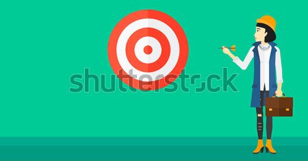 Young business woman and dart board. Stock photo © RAStudio