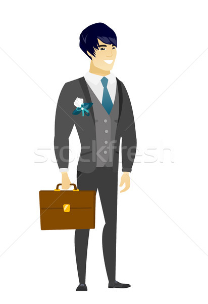 Asian groom holding briefcase. Stock photo © RAStudio