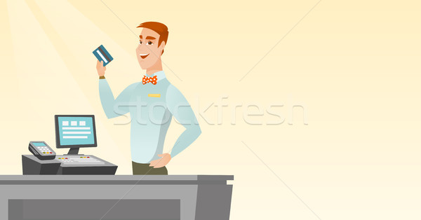 Kassierer halten Kreditkarte lächelnd stehen Stock foto © RAStudio