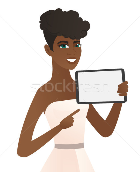 Young african fiancee holding tablet computer. Stock photo © RAStudio