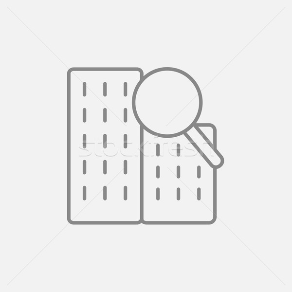 Condominium and magnifying glass line icon. Stock photo © RAStudio