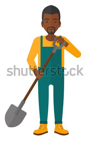 Stock photo: Farmer holding corn.