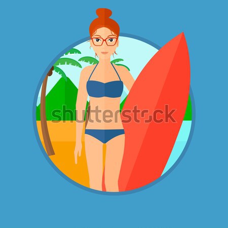 Stock photo: Surfer holding surfboard.