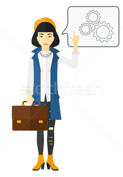 Business woman pointing at cogwheels. Stock photo © RAStudio