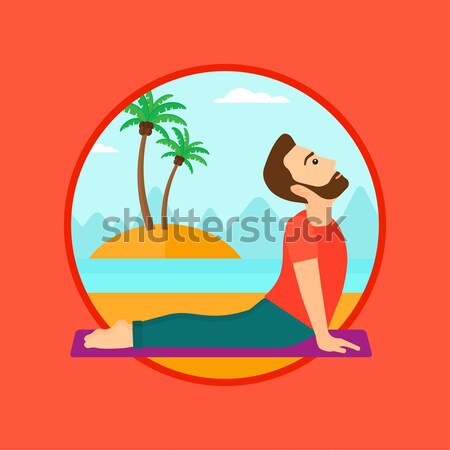 Man practicing yoga upward dog pose on the beach. Stock photo © RAStudio