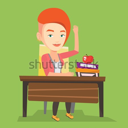 Student raising hand in class for an answer. Stock photo © RAStudio