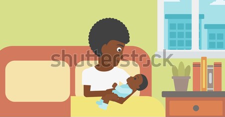 Mother feeding baby. Stock photo © RAStudio