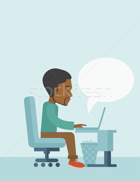 African siiting infront his computer. Stock photo © RAStudio