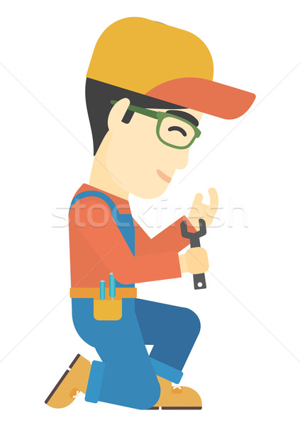 Repairman holding spanner. Stock photo © RAStudio