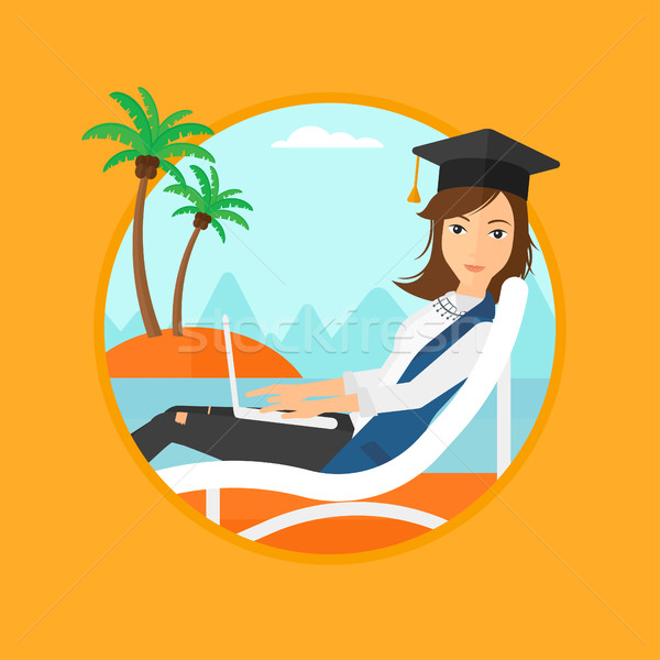 Stock photo: Graduate lying in chaise lounge with laptop.