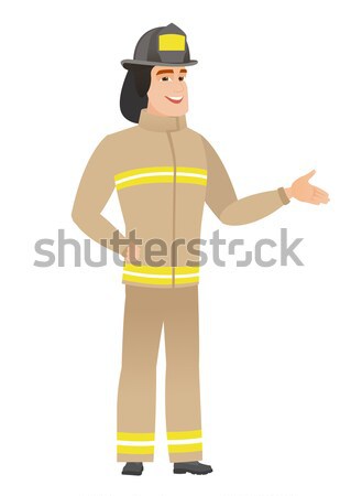 Young caucasian firefighter in uniform. Stock photo © RAStudio