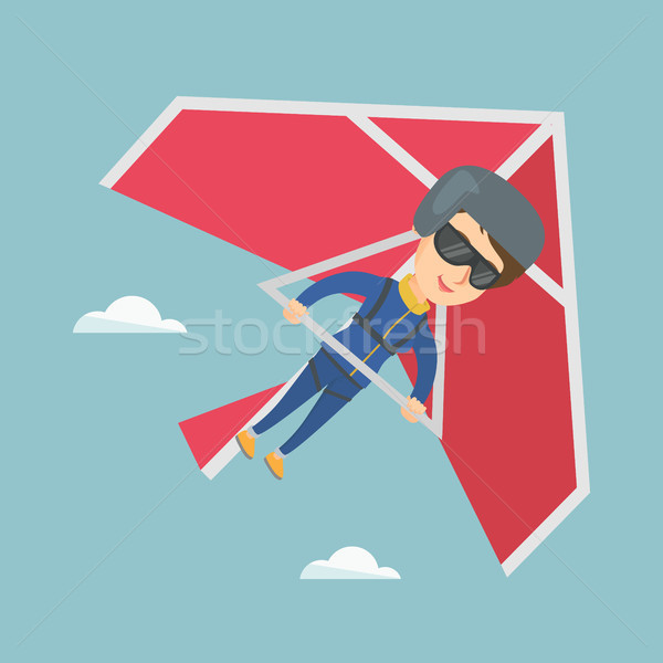 Young caucasian woman flying on hang-glider. Stock photo © RAStudio