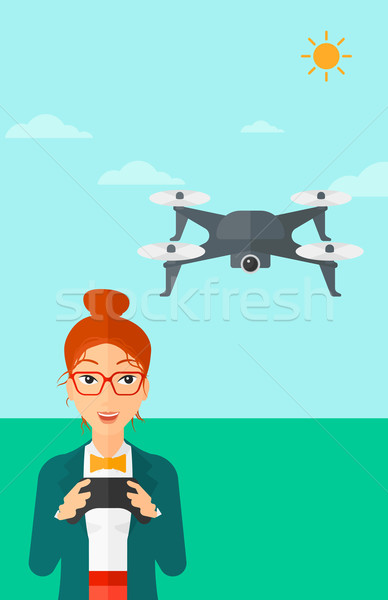 Woman flying drone. Stock photo © RAStudio