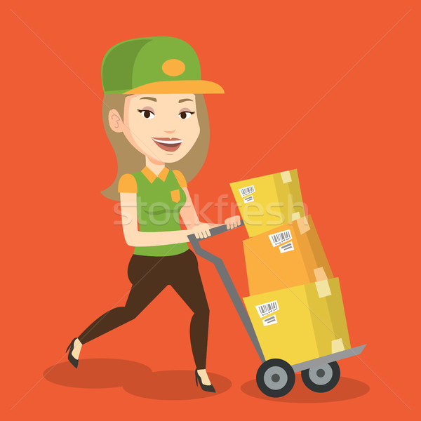 Delivery postman with cardboard boxes on trolley. Stock photo © RAStudio