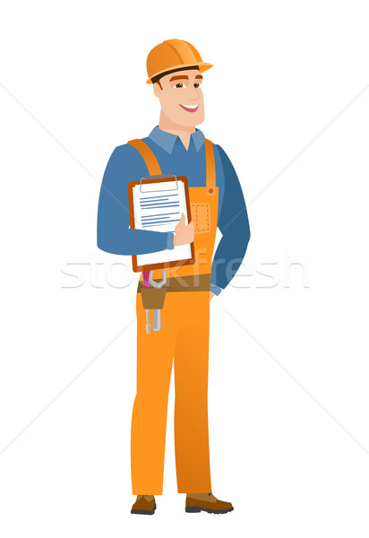 Builder holding clipboard with papers. Stock photo © RAStudio