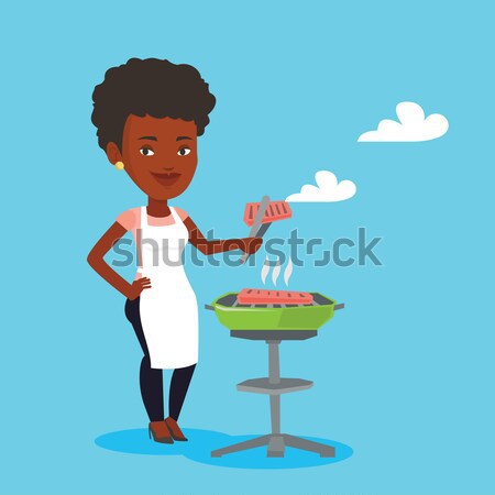 Stockfoto: Vrouw · koken · biefstuk · barbecue · afrikaanse · outdoor