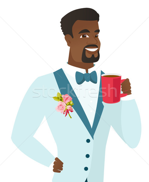 Young african-american groom holding cup of coffee Stock photo © RAStudio