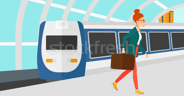 Woman going out of train. Stock photo © RAStudio