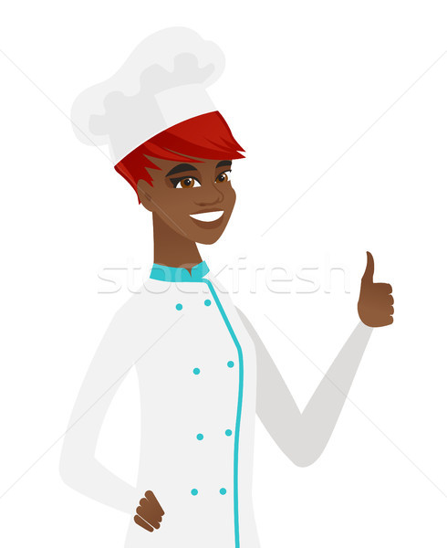 Young african-american chef giving thumb up. Stock photo © RAStudio