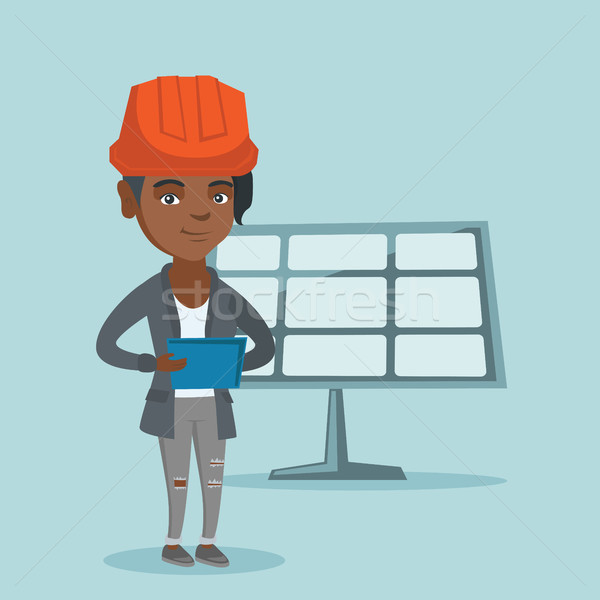 Worker of solar power plant using a digital tablet Stock photo © RAStudio