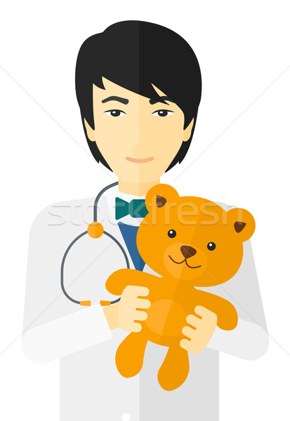 Pediatrician holding teddy bear. Stock photo © RAStudio
