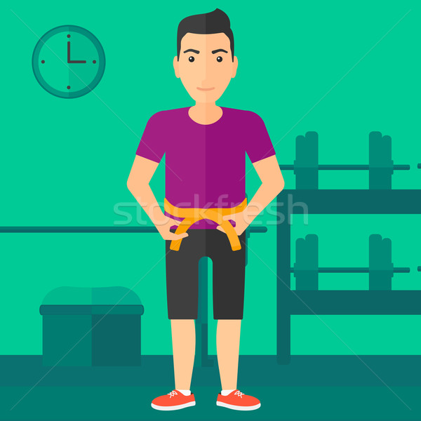 Man measuring waist. Stock photo © RAStudio
