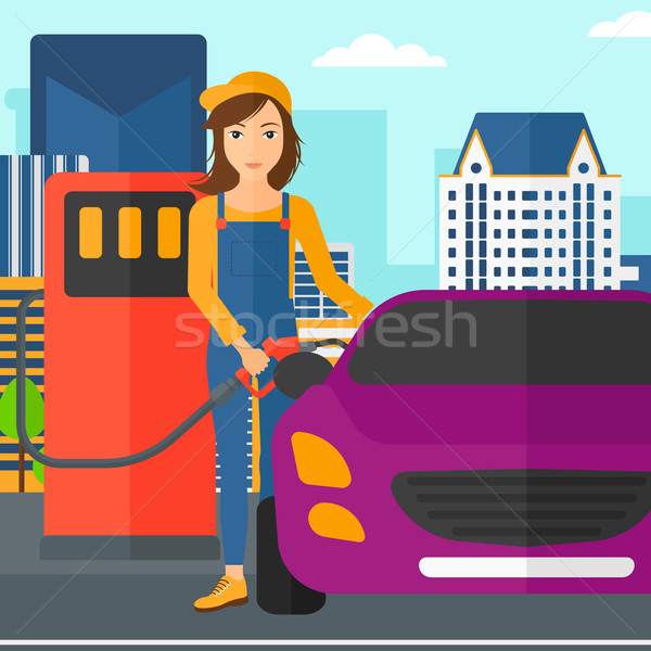 Mujer relleno hasta combustible coche ciudad Foto stock © RAStudio