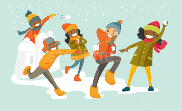 Multicultural family playing snowball fight. Stock photo © RAStudio