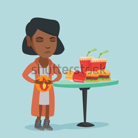 African woman holding tray full of fast food. Stock photo © RAStudio