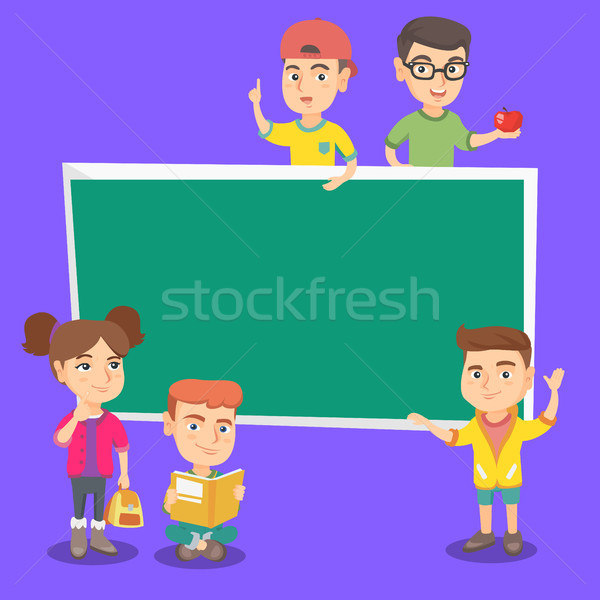 Caucasian classmates standing near the blackboard. Stock photo © RAStudio