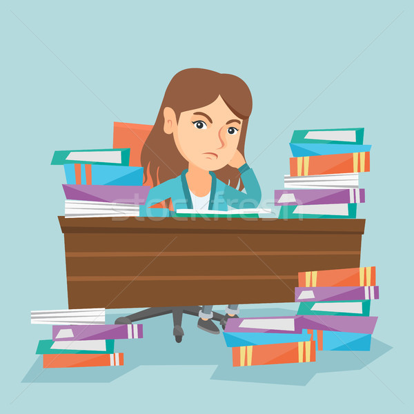 Student sitting at the table with piles of books. Stock photo © RAStudio