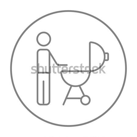 Stock photo: Man at barbecue grill line icon.