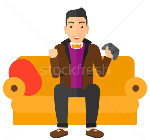 Man spelen video game gelukkig vergadering sofa Stockfoto © RAStudio