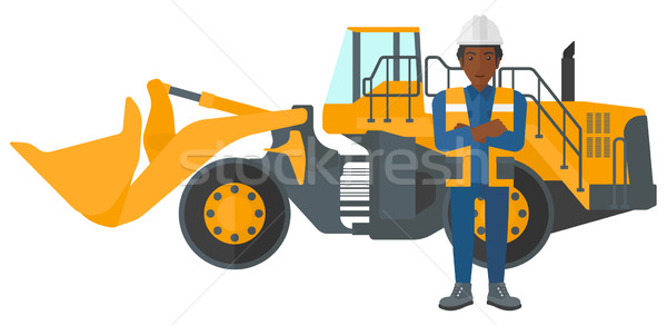 Stock photo: Miner with mining equipment on background.
