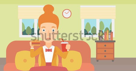 Woman eating hamburger.  Stock photo © RAStudio