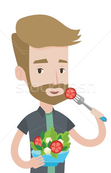 Stock photo: Man eating healthy vegetable salad.