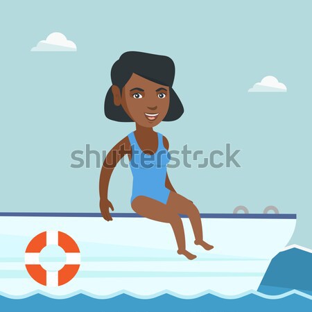 Young happy woman tanning on sailboat. Stock photo © RAStudio