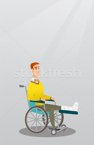 Man with broken leg sitting in a wheelchair. Stock photo © RAStudio