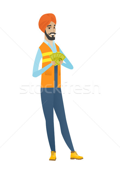 Happy hindu builder holding money. Stock photo © RAStudio