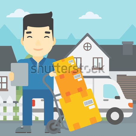 Delivery man with cardboard boxes. Stock photo © RAStudio