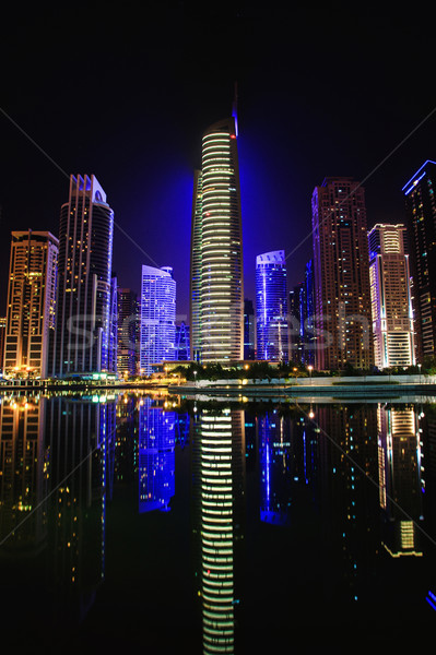 Stock fotó: Kilátás · tornyok · felhőkarcolók · éjszaka · Dubai · üzlet